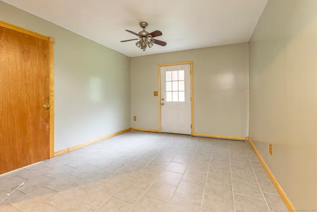 an empty room with a empty space and window