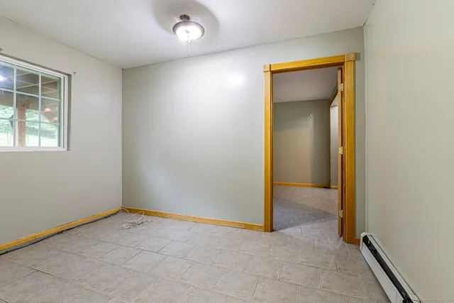a view of a room with window and furniture