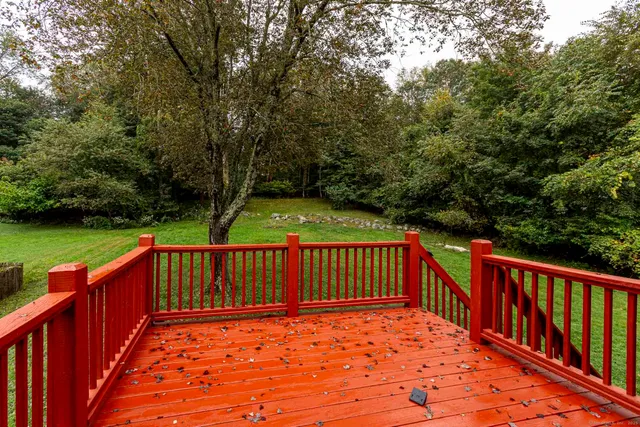 a view of a backyard with a deck
