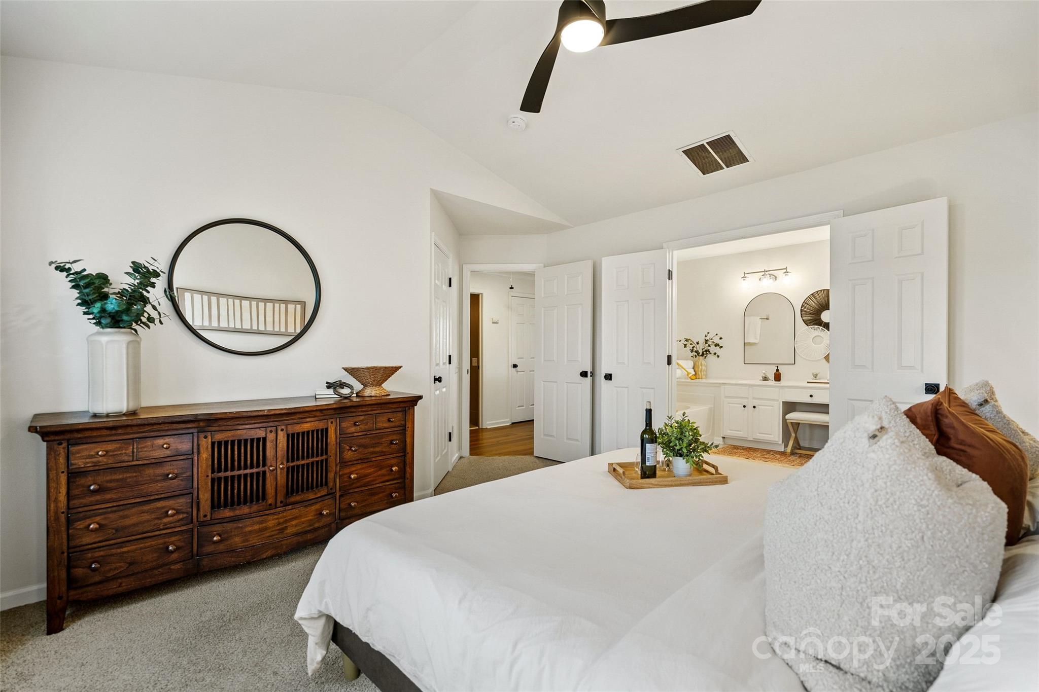 11708 Huxley Road Charlotte, NC 28277 - Photo 24 of 40 a bedroom with a bed and a dresser