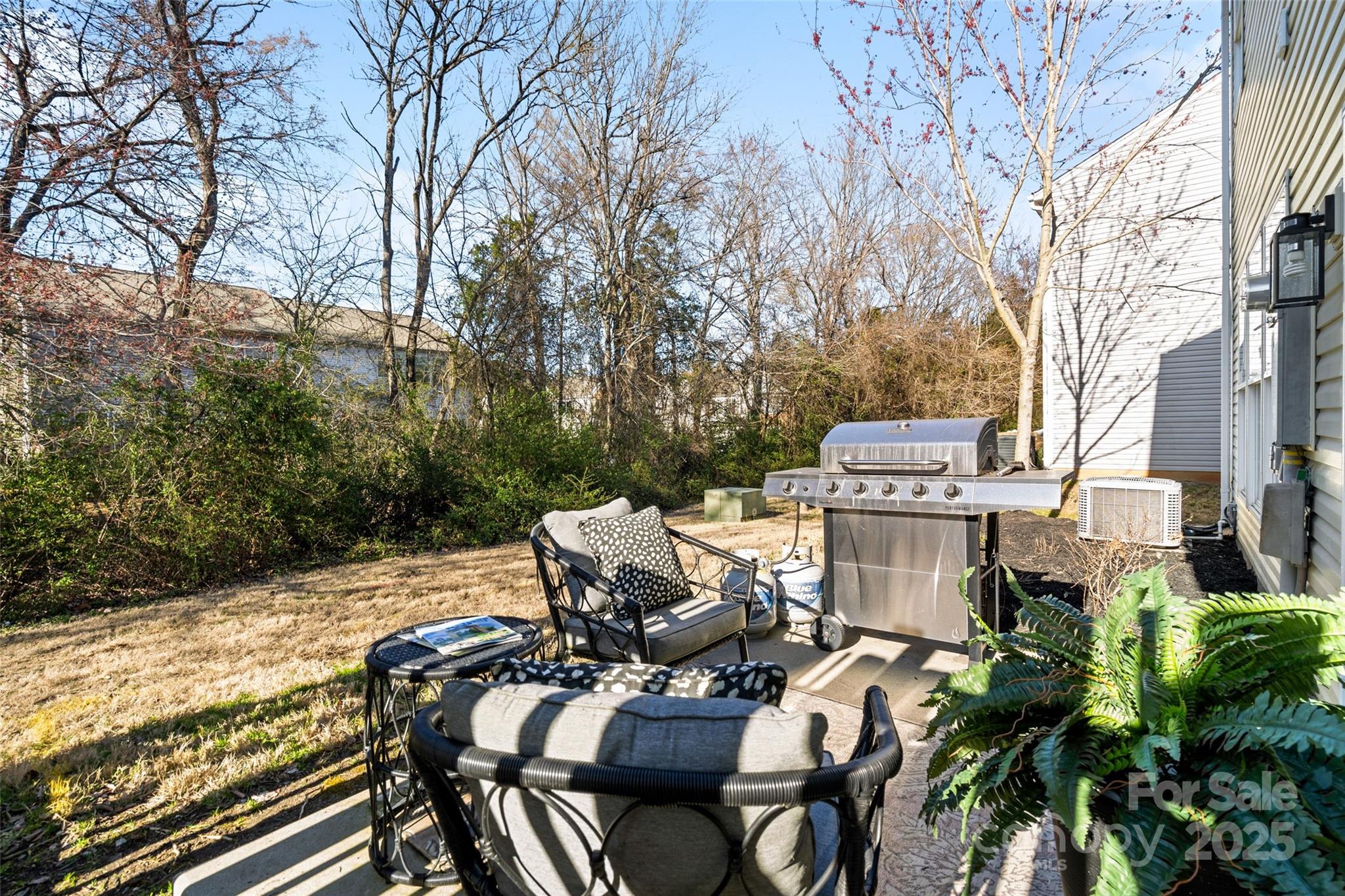 11708 Huxley Road Charlotte, NC 28277 - Photo 33 of 40 a view of a patio with table and chairs with wooden fence and floor