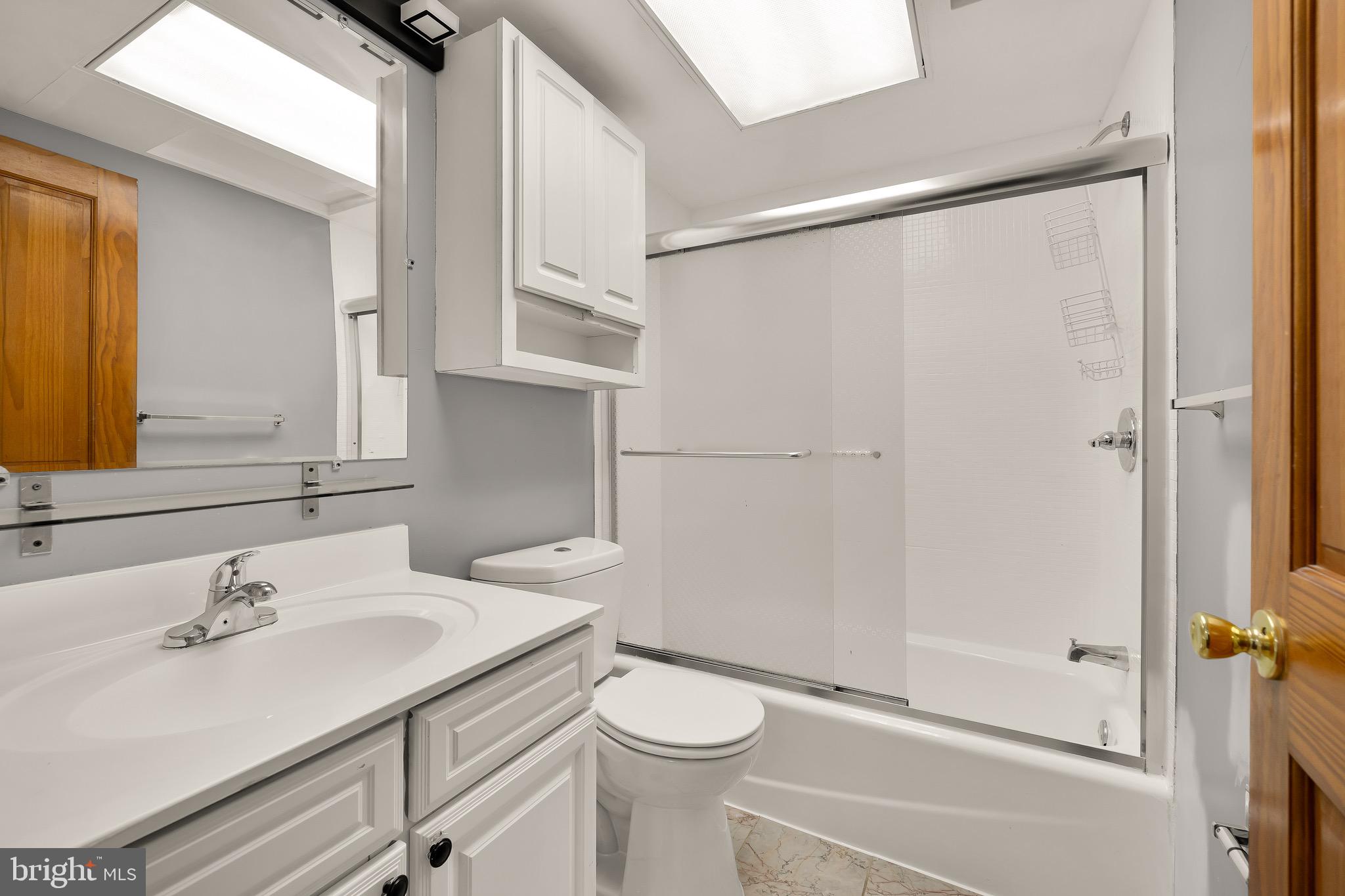 500 9th Street Southeast Washington, DC 20003 - Photo 15 of 34 a bathroom with a sink a toilet and shower