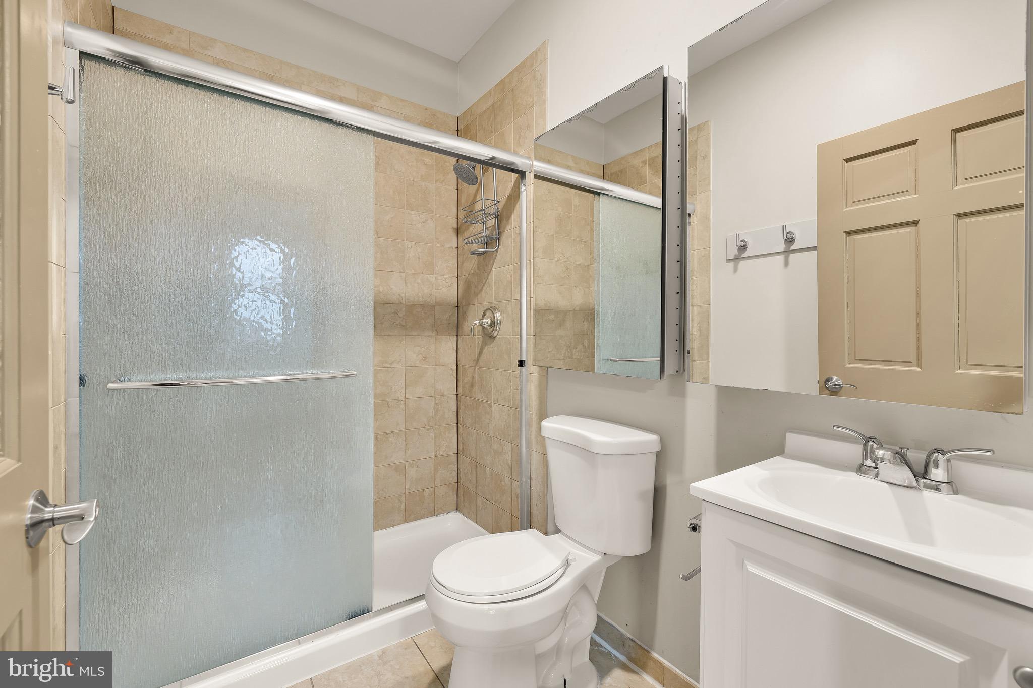 500 9th Street Southeast Washington, DC 20003 - Photo 27 of 34 a bathroom with a granite countertop sink toilet and shower