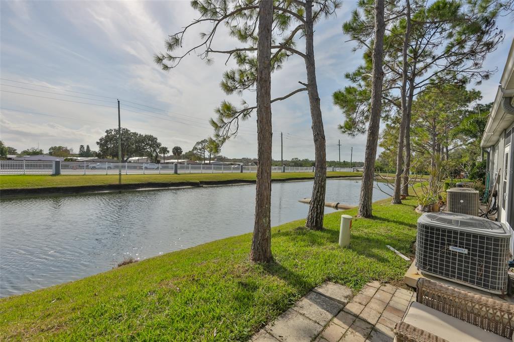 477 Countryside Key Boulevard Oldsmar, FL 34677 - Photo 20 of 46 a view of a lake with houses in the background