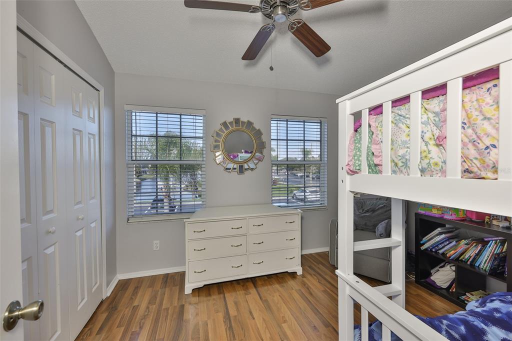 477 Countryside Key Boulevard Oldsmar, FL 34677 - Photo 23 of 46 a view of walk in closet with clothes and shoes