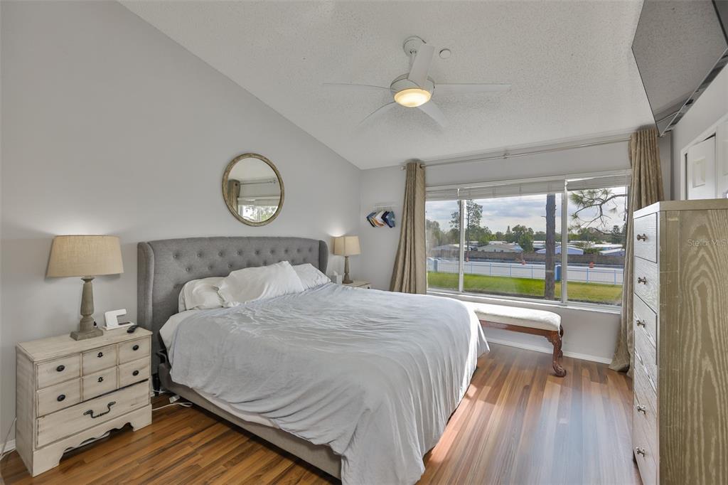 477 Countryside Key Boulevard Oldsmar, FL 34677 - Photo 26 of 46 a bed room with a bed and a floor to ceiling window