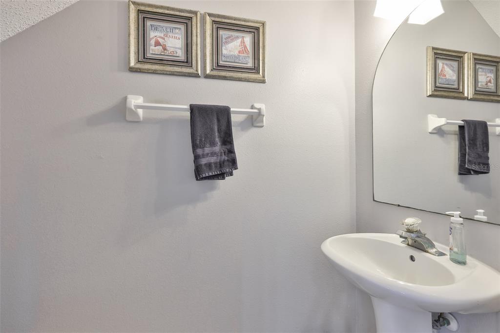 477 Countryside Key Boulevard Oldsmar, FL 34677 - Photo 30 of 46 a bathroom with a sink and a mirror