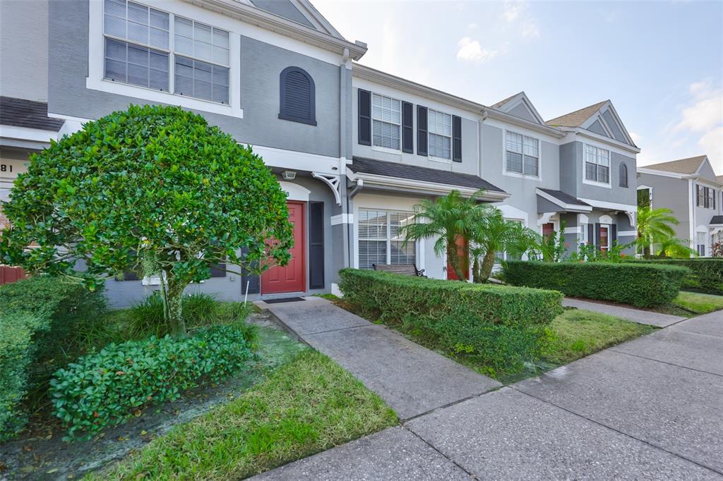 477 Countryside Key Boulevard Oldsmar, FL 34677 - Photo 45 of 46 a view of a brick building next to a yard