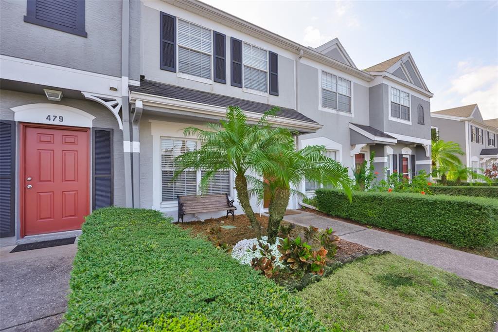 477 Countryside Key Boulevard Oldsmar, FL 34677 - Photo 46 of 46 a front view of a house with garden