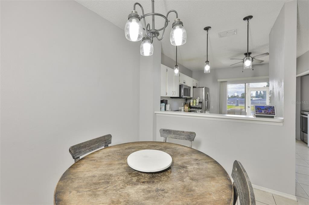 477 Countryside Key Boulevard Oldsmar, FL 34677 - Photo 7 of 46 a kitchen with a table and chairs in it