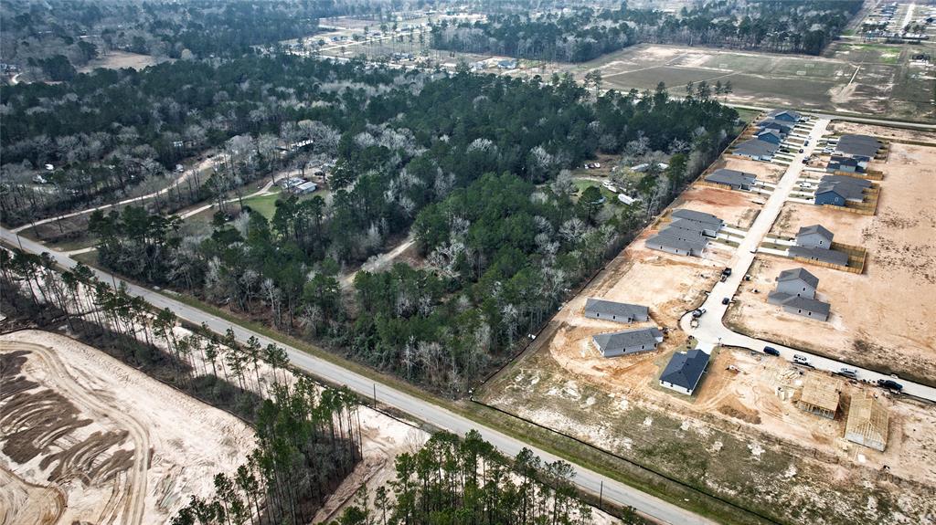Tbd 6.77-acres Tbd 6.77-acres Goodman Road Conroe, TX 77306 - Photo 3 of 5 a city view from a balcony