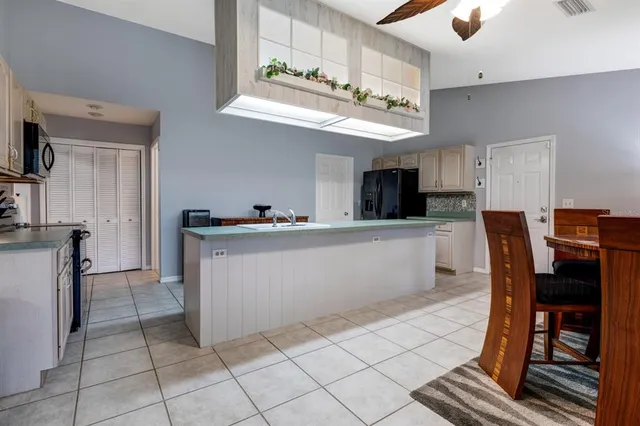 a view of kitchen with cabinets and outdoor seating