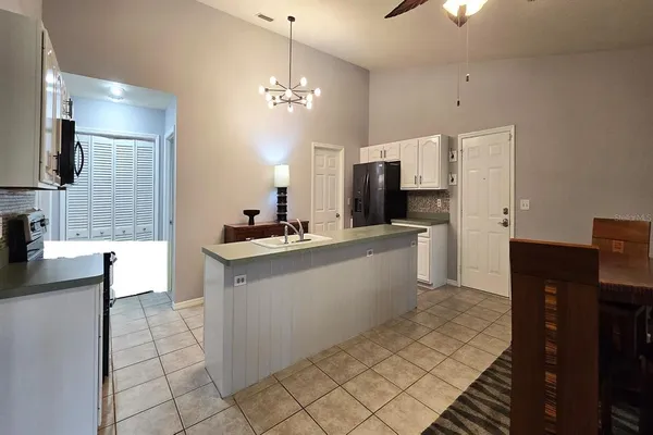 a large kitchen with cabinets