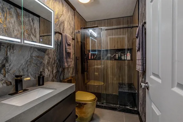 a bathroom with a sink and a mirror