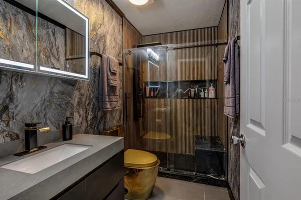 a bathroom with a sink and a mirror