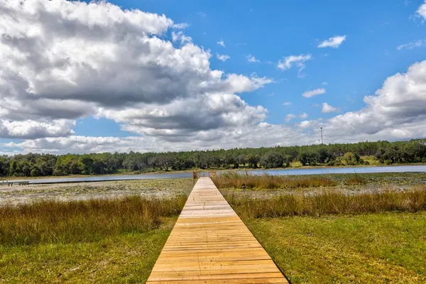 a view of outside space swimming pool and lake