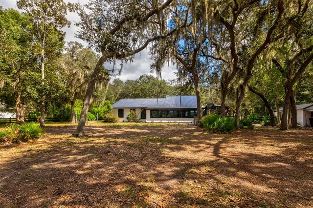 a house with trees in front of it