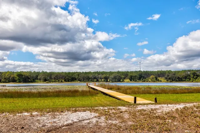 a view of a lake with a yard