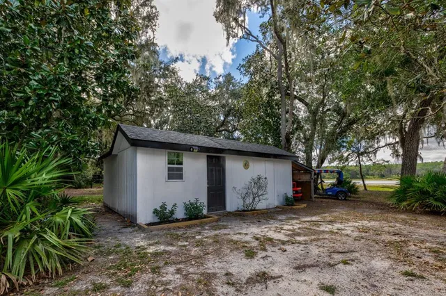 a view of a house with a yard and garage