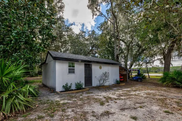 a view of a house with a yard and garage