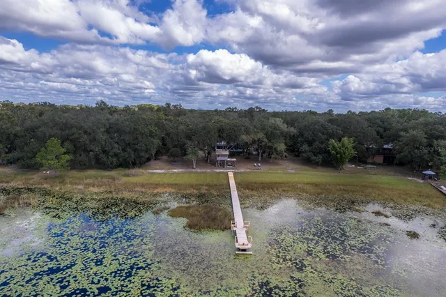 a view of a lake with a yard