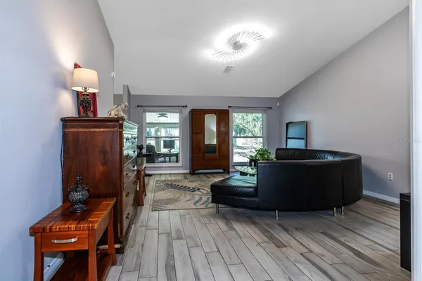 a living room with furniture and a window
