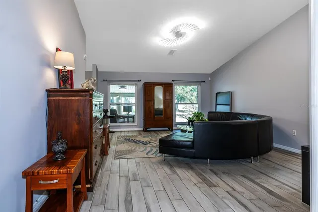 a living room with furniture and a window