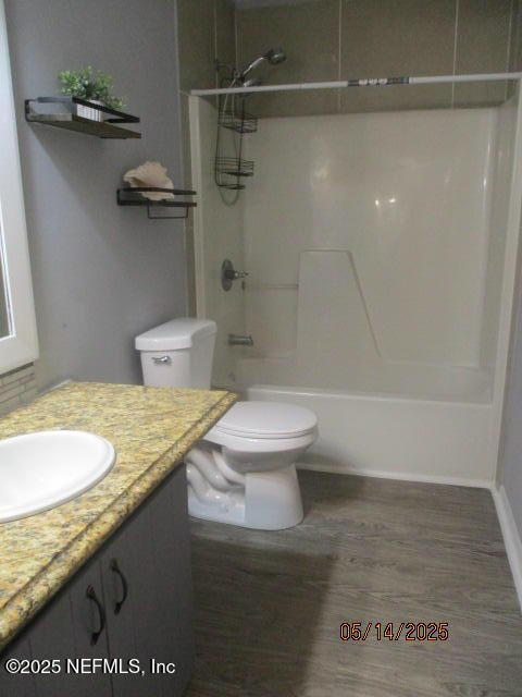 716 Shortputt Drive Macclenny, FL 32063 - Photo 16 of 24 a bathroom with a granite countertop sink a toilet and shower
