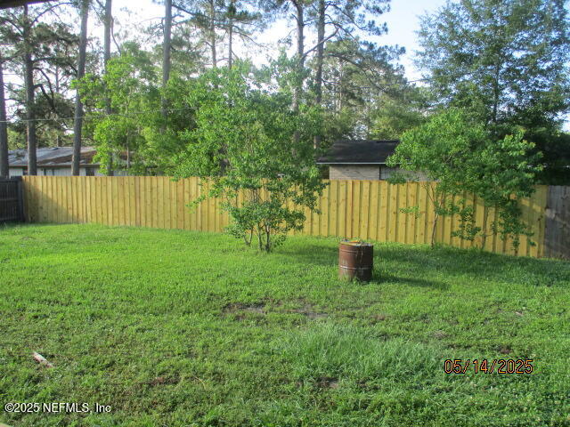 716 Shortputt Drive Macclenny, FL 32063 - Photo 19 of 24 a view of a backyard with a small cabin