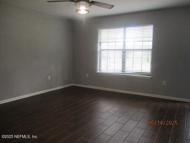 716 Shortputt Drive Macclenny, FL 32063 - Photo 4 of 24 an empty room with wooden floor and windows