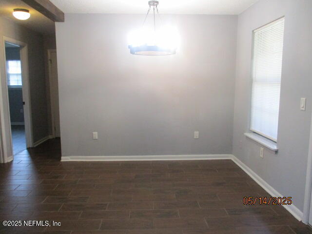 716 Shortputt Drive Macclenny, FL 32063 - Photo 10 of 24 an empty room with wooden floor and windows