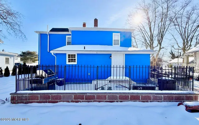 a view of an empty room and wooden floor