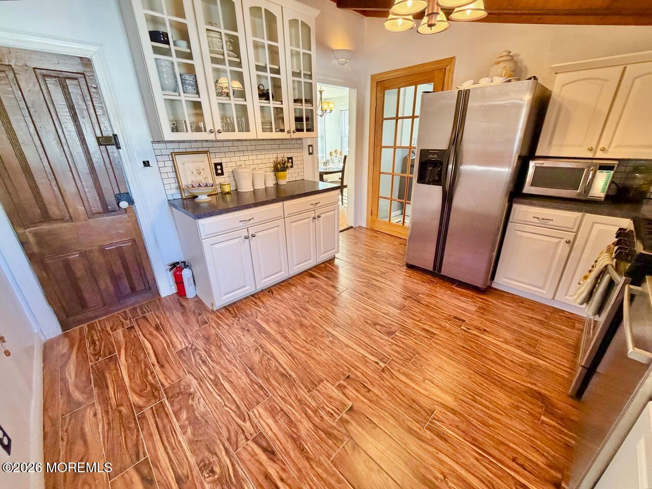 623 Main Street Leesburg, NJ 08327 - Photo 32 of 68 a view of an empty room with wooden floor and furniture