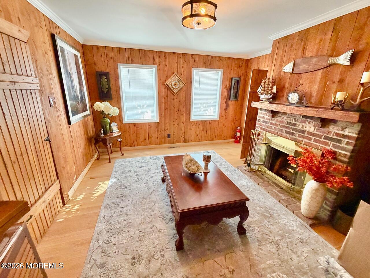 623 Main Street Leesburg, NJ 08327 - Photo 48 of 68 a living room with furniture a fireplace and a floor to ceiling window