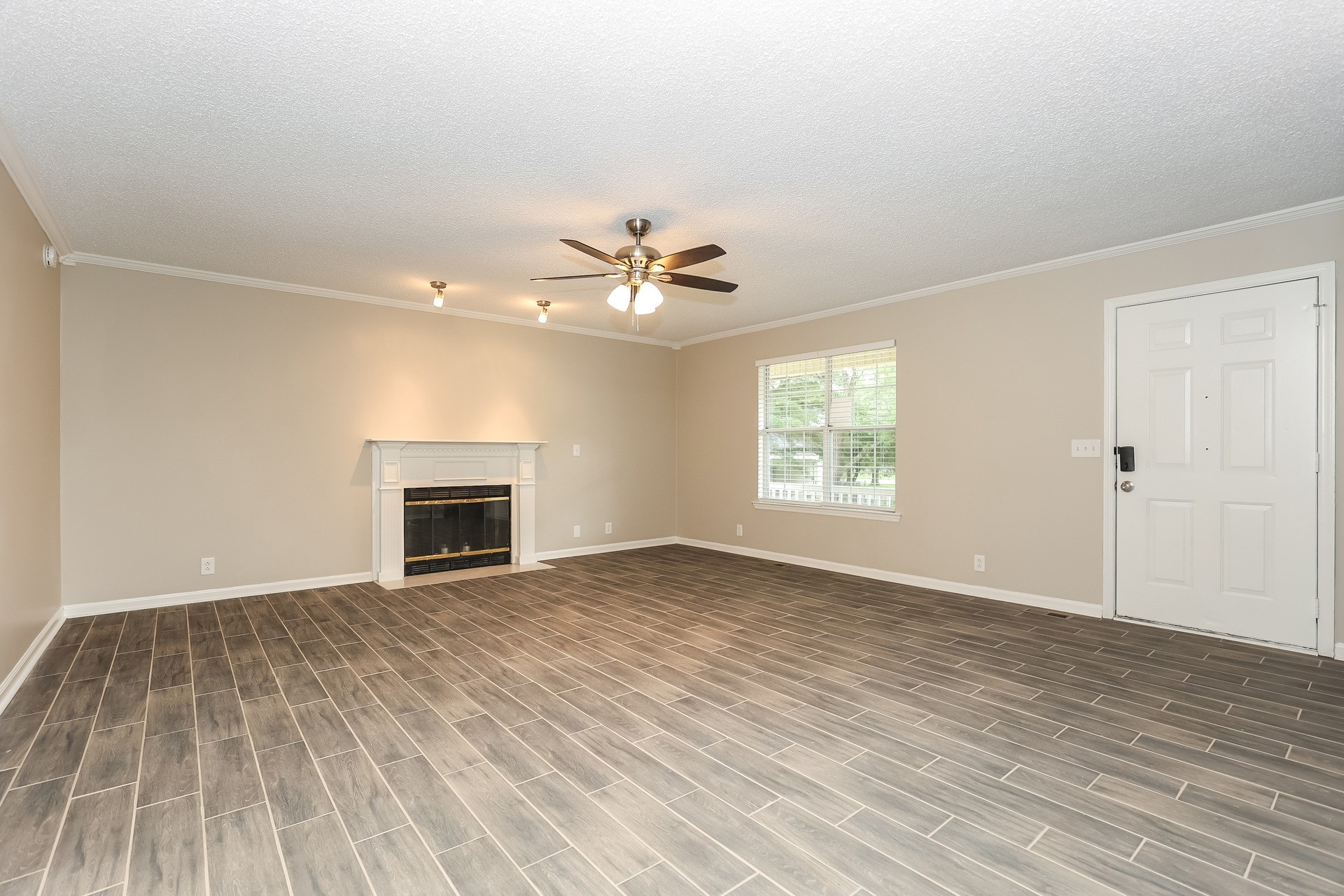 2503 Splinter Court Murfreesboro, TN 37130 - Photo 3 of 17 an empty room with windows and a fireplace