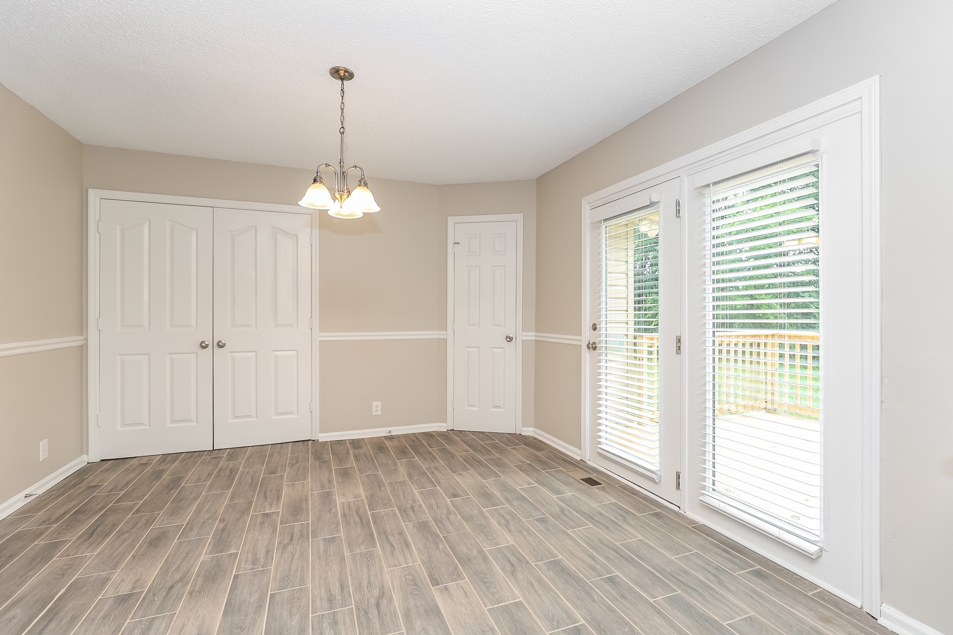 2503 Splinter Court Murfreesboro, TN 37130 - Photo 4 of 17 an empty room with wooden floor and windows