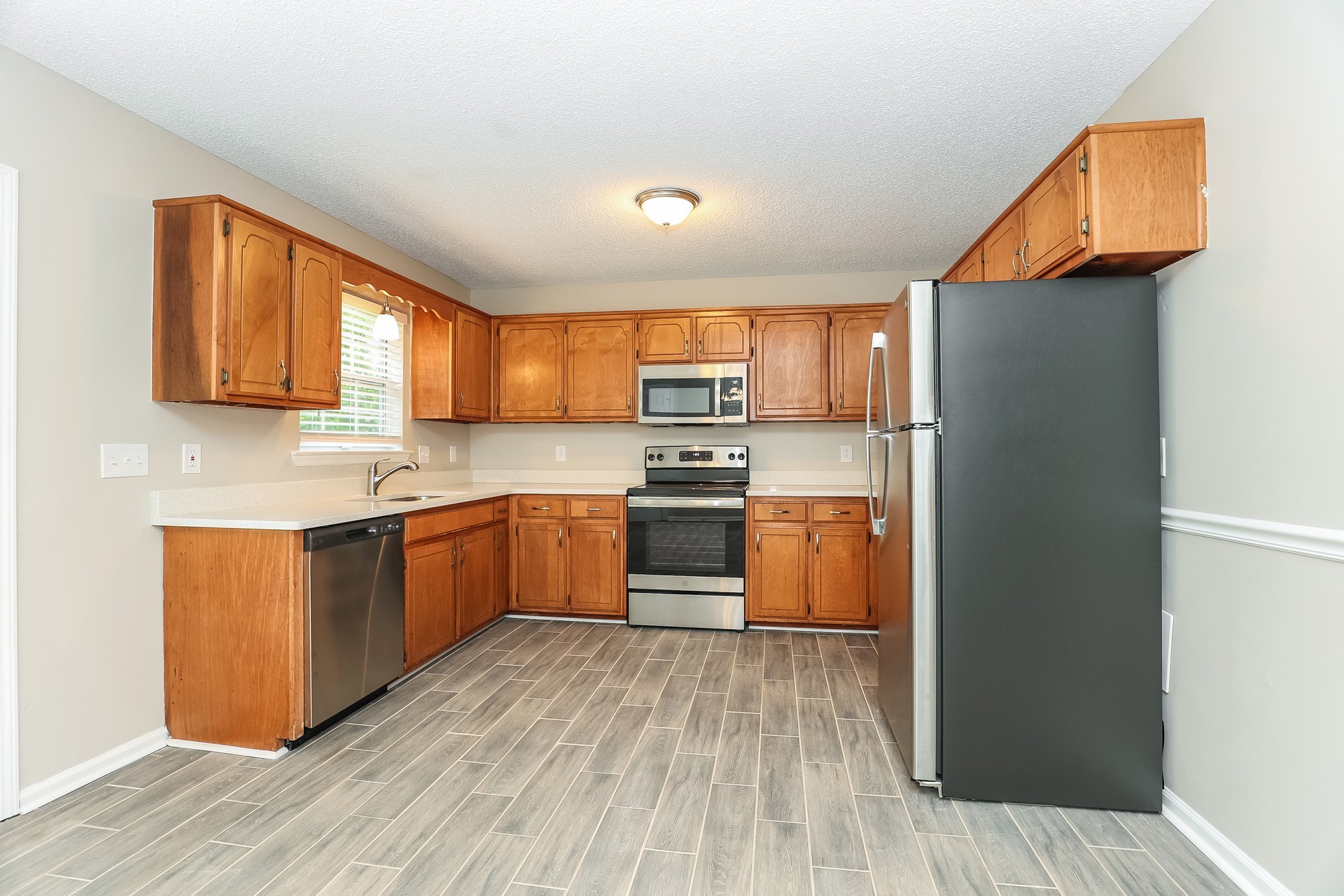 2503 Splinter Court Murfreesboro, TN 37130 - Photo 6 of 17 a kitchen with a refrigerator sink and cabinets