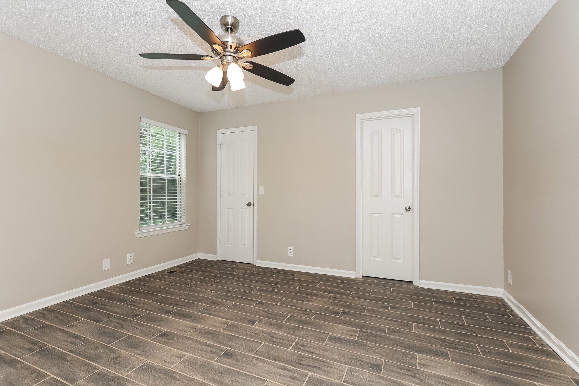 2503 Splinter Court Murfreesboro, TN 37130 - Photo 8 of 17 a view of an empty room with wooden floor and a ceiling fan