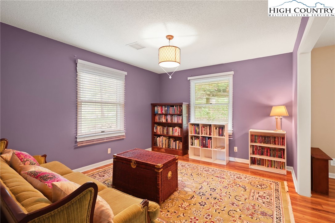 357 Kalmia Lane Boone, NC 28607 - Photo 18 of 41 a living room with furniture a rug and a window