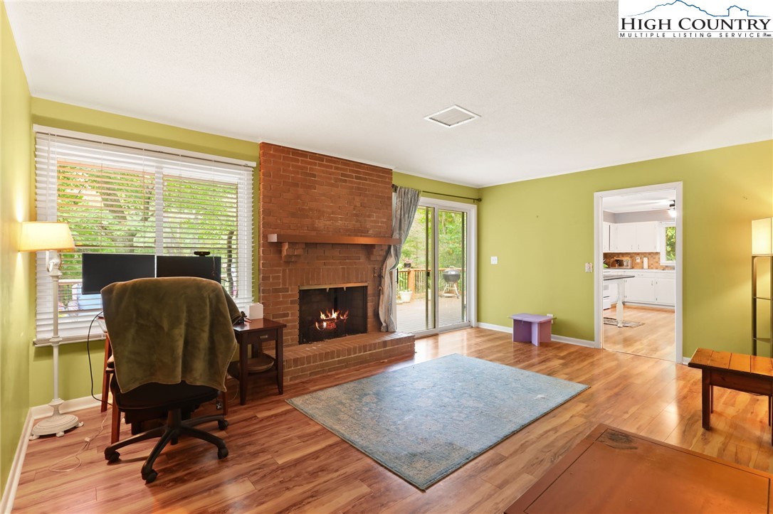357 Kalmia Lane Boone, NC 28607 - Photo 20 of 41 a living room with furniture rug and a fireplace