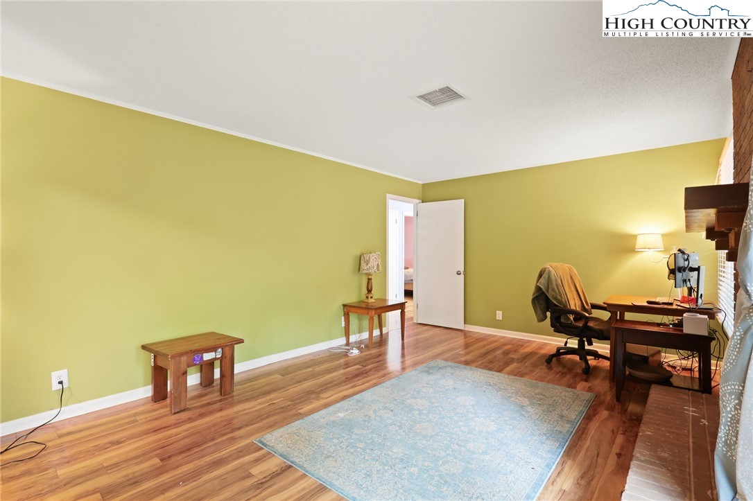 357 Kalmia Lane Boone, NC 28607 - Photo 21 of 41 a workspace with furniture and wooden floor