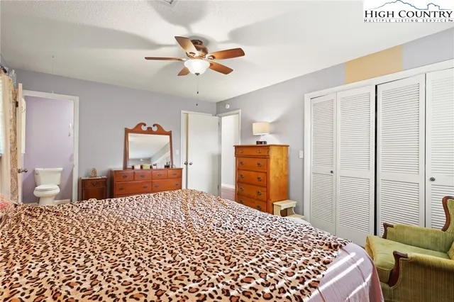 a bedroom with a bed and a closet