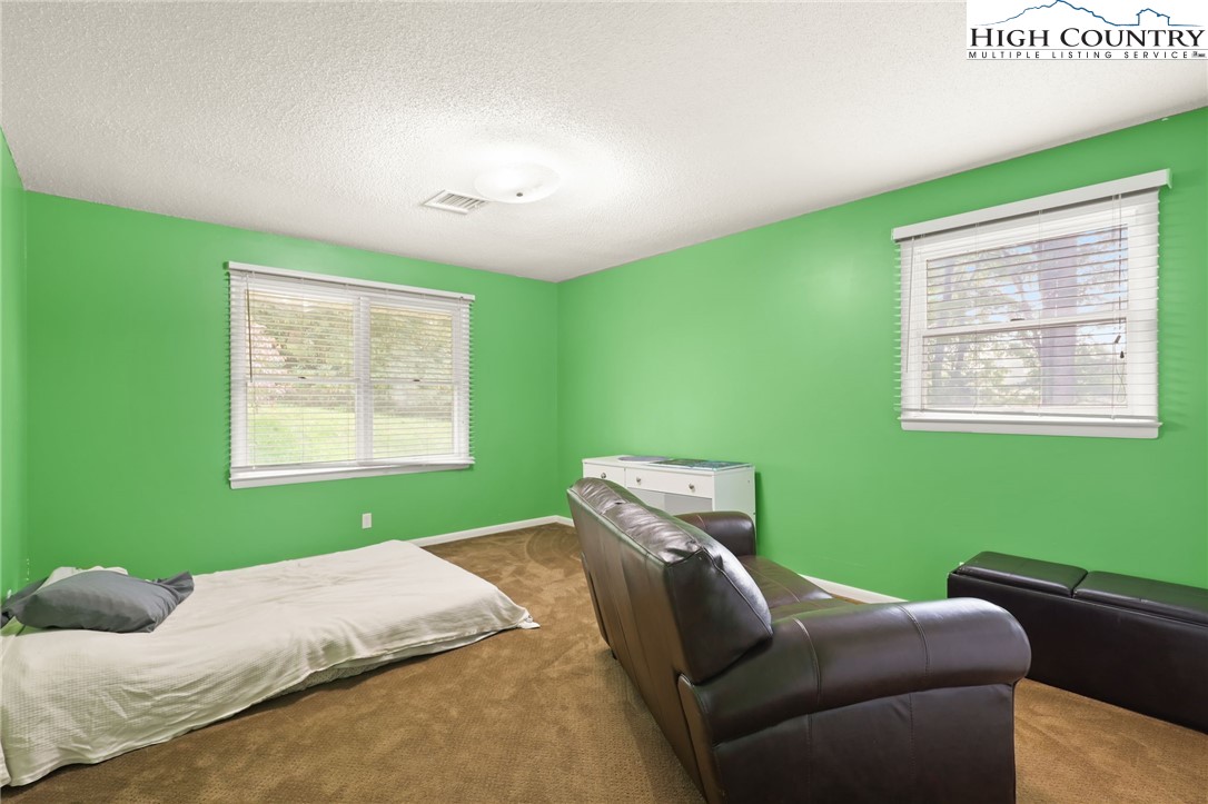 357 Kalmia Lane Boone, NC 28607 - Photo 24 of 41 a bedroom with a bed and a window