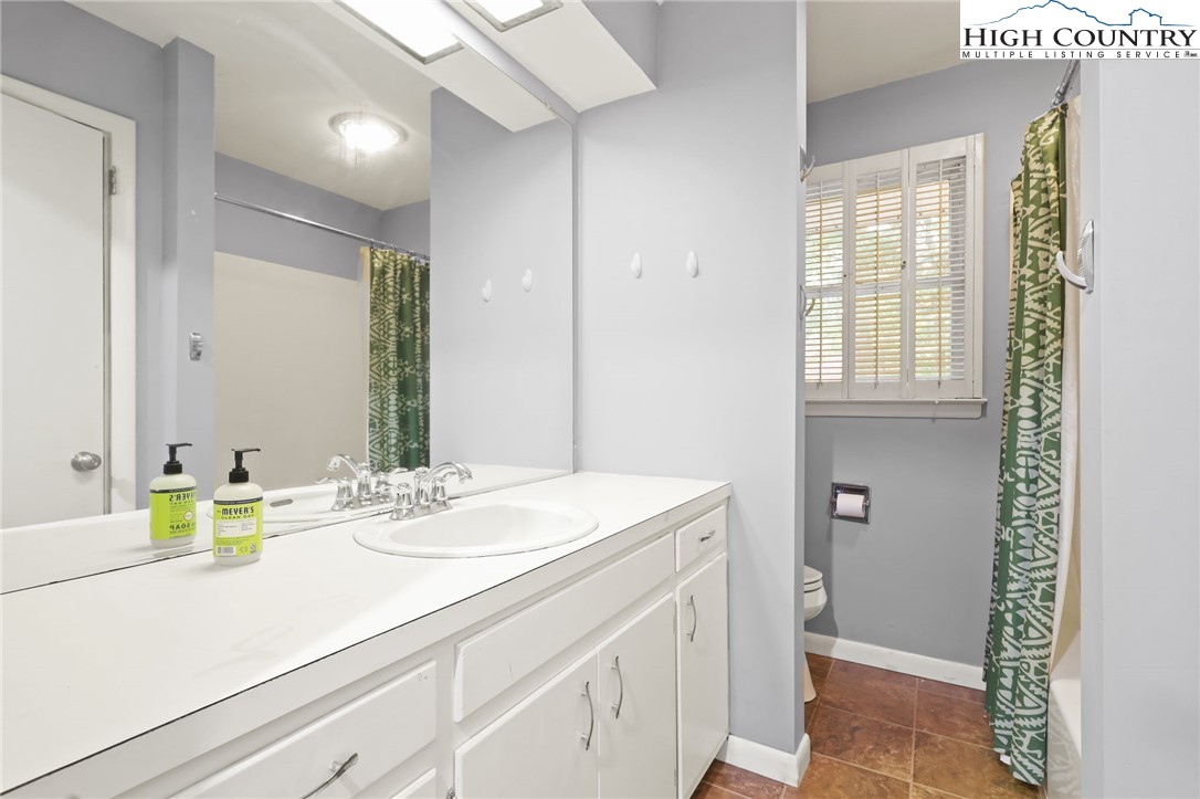 357 Kalmia Lane Boone, NC 28607 - Photo 28 of 41 a bathroom with a sink and a mirror