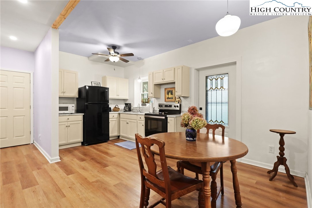 357 Kalmia Lane Boone, NC 28607 - Photo 30 of 41 a kitchen with stainless steel appliances a dining table and chairs