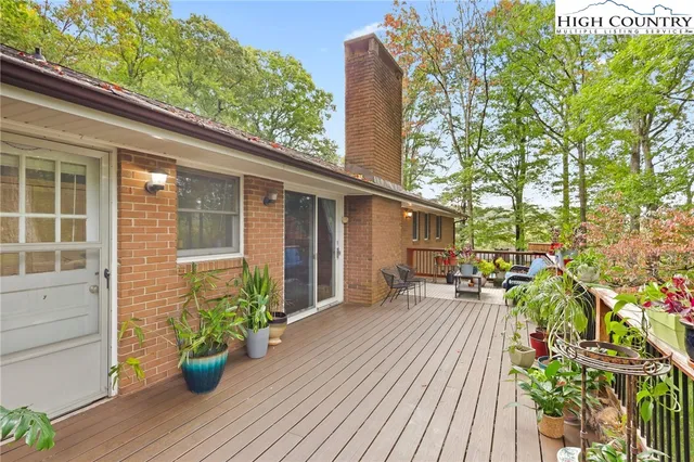 a house with potted plants in front of it