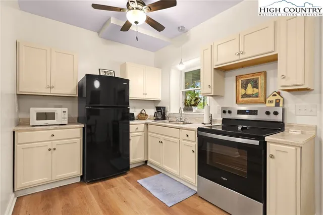 a kitchen with a refrigerator stove and sink