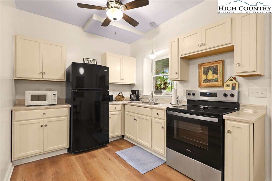 357 Kalmia Lane Boone, NC 28607 - Photo 31 of 41 a kitchen with a refrigerator stove and sink