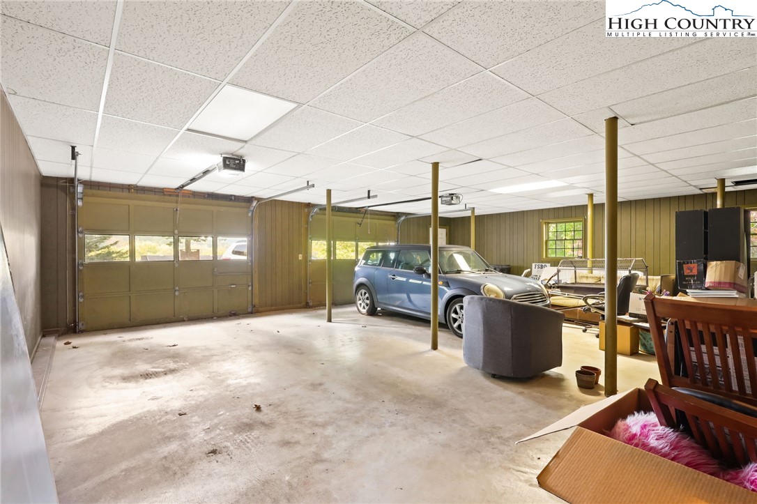 357 Kalmia Lane Boone, NC 28607 - Photo 41 of 41 a living room with furniture a rug and a large window