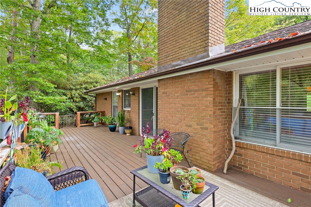 357 Kalmia Lane Boone, NC 28607 - Photo 5 of 41 a view of house with wooden floor and a potted plant
